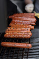 Street food background with assortment of grilled sausages