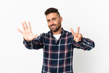 Naklejka premium Caucasian man isolated on white background counting seven with fingers