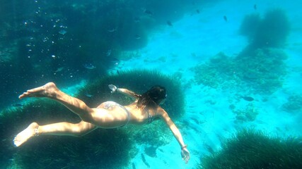 young woman snorkeling in Menorca