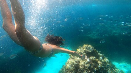 Naklejka na ściany i meble young woman snorkeling in Menorca