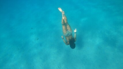 young woman snorkeling in Menorca