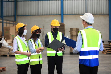 Team workers wear protective face masks for safety industrial factory. worker meeting before start working in factory or warehouse