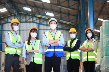 Team workers wear protective face masks for safety industrial factory. worker meeting before start working in factory or warehouse