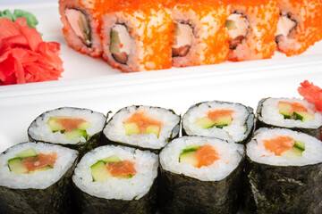 Japanese cuisine - sushi and roll sets on a white background.