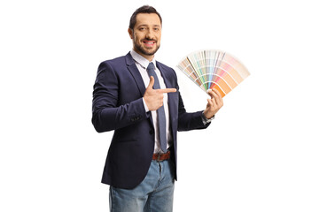 Man holding a color palette and pointing