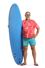 Full length portrait of a mature male tourist holding a surfing board