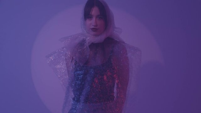 The girl made a suit out of polyethylene. An example of the rational use of polyethylene in fashion.
