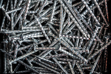Small metal shoe nails, close-up, top view, Furniture nails