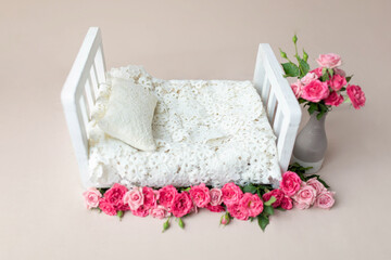 baby cot for a photo shoot of newborns. props for a photo shoot. the bed is decorated with pink...