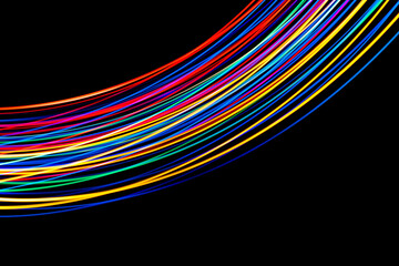 Luminous multicolored wavy lines rainbow on a black background
