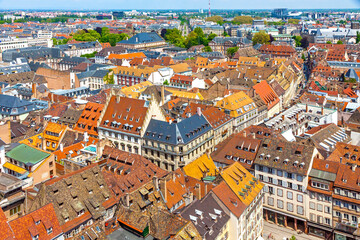 Fototapeta na wymiar Skyline aerial view of Strasbourg old town, Grand Est region, France. Strasbourg Cathedral. View to corner of Rue des Juifs and Rue des Dome streets