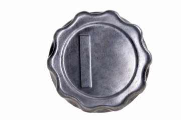 Metal fuel filler cap from a truck. Closing the fuel tank in the car.