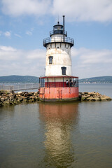 Sleepy Hollow, NY - USA - July 5, 2021: Vertical view of the scenic Tarrytown Light, a sparkplug lighthouse on the east side of the Hudson River in Sleepy Hollow.