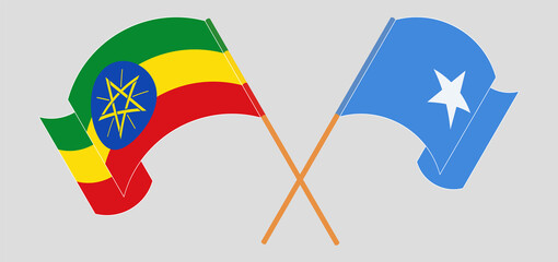 Crossed and waving flags of Ethiopia and Somalia