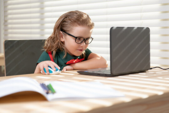 Schoolboy Studying Homework Math During Her Online Lesson At Home. Pupil Study With Video Call Teacher.