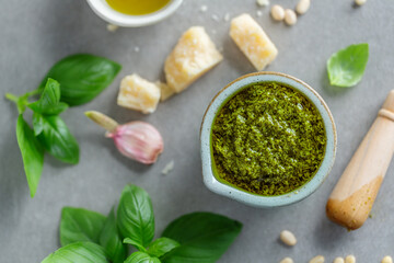 Pesto sauce in small bowl on table