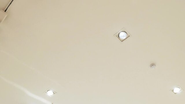 The ceiling spot light flashes frequently. Defective lamp, a short circuit, bright flashes.