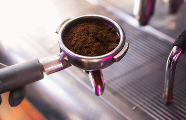 Coffee tempering. Ground coffee in tempera. The initial stage of brewing.