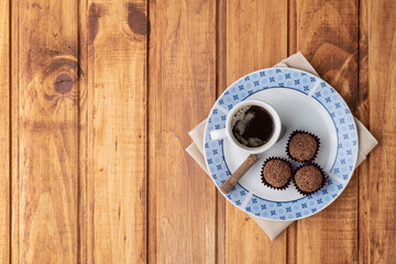 Typical brazilian brigadeiros with coffee with copy space