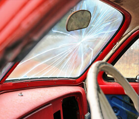 Broken windshield rusty old car