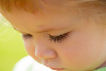 Portrait of a cute baby. Close up caucasian kids face. Closeup head of funny kid.