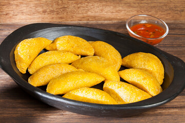 Delicious empanadas, Colombian cuisine. on the wooden table