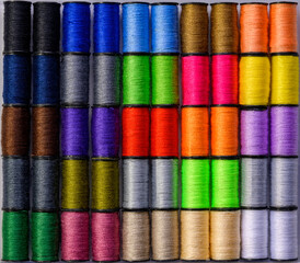 A very colourful layout of cotton spools