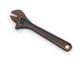 Adjustable wrench or crescent wrench isolated on white. Old and rusted Vintage open ended wrench in real life condition.