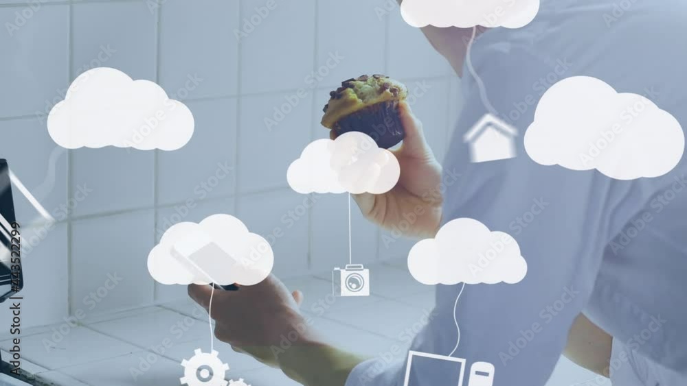 Aufkleber animation of clouds and media icons over man using smartphone
