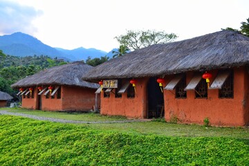 Santichon Village, A house built from clay, modified to bring branches and dry leaves to the roof, is a village in the Yunnan Chinese Cultural Center.