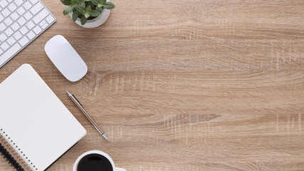 Top view wooden workspace office desk with computer and office supplies. Flat lay work table with...