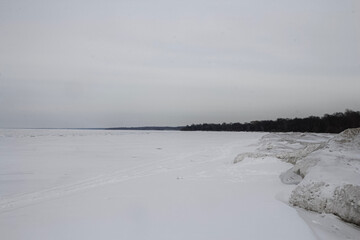 Frozen lake covered by snow like white desert