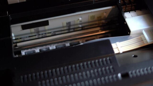 The printer carriage is moving. Nozzle cleaning and head test run