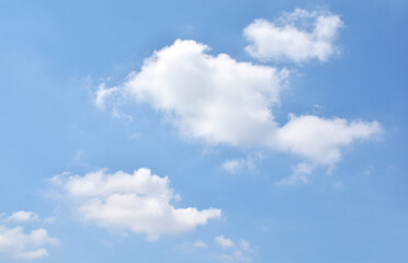 Obraz premium Bright Blue sky with white cloud. Beautiful sky background and wallpaper. Clear day and good weather in the morning.