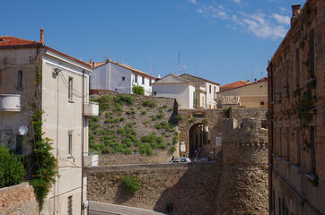 Fototapeta premium Entrance to the ancient village of Termoli with the belvedere tower in the foreground. Molise, Italy