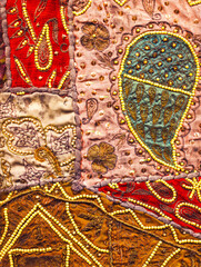 Fototapeta premium Indian sari pieces recycled and sewn together to make wall hangings or cushions