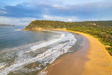 Early morning aerial views at the seaside with fog, cloud and waves