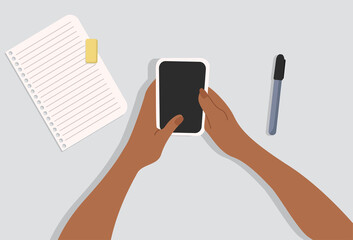 Hands holding the phone. Notepaper and marker on the table. Top-down view. Modern vector illustrated banner, web. Work from home concept.