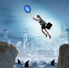 Businesswoman flying on balloon in business concept