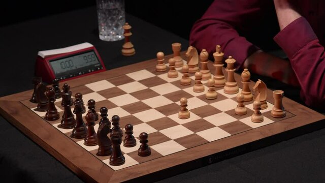 Chess match English opening with queen's gambit declined- low light chess board