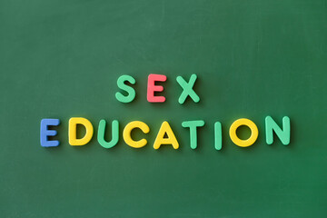 Text SEX EDUCATION on chalkboard