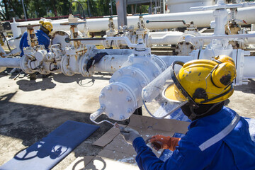 Male worker painted pipes