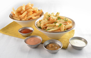 deep fried golden French fries with parmesan cheesy sauce in white background western snack cuisine halal fast food menu