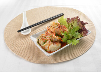double boiled meat dumpling with spicy mala chilli sauce in white background asian halal menu