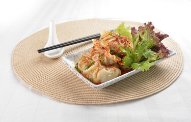 double boiled meat dumpling with spicy mala chilli sauce in white background asian halal menu