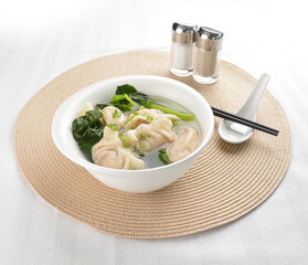 double boiled meat dumpling and vegetables in hot soup bowl in white background asian vegan halal menu