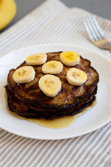 Homemade Banana Pancakes with Honey, low angle view.