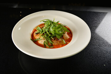 cheesy baked cheese meat ball with red tomato bolognese sauce and green vegetables in dark bar counter background western cuisine halal menu