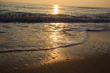 Morning sunrise light shining on ocean wave
