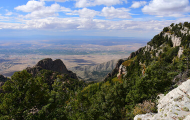 Fototapeta na wymiar panoramic view of albuquerque, forest, and granite peaks on a fall day from sandia peak, new mexico